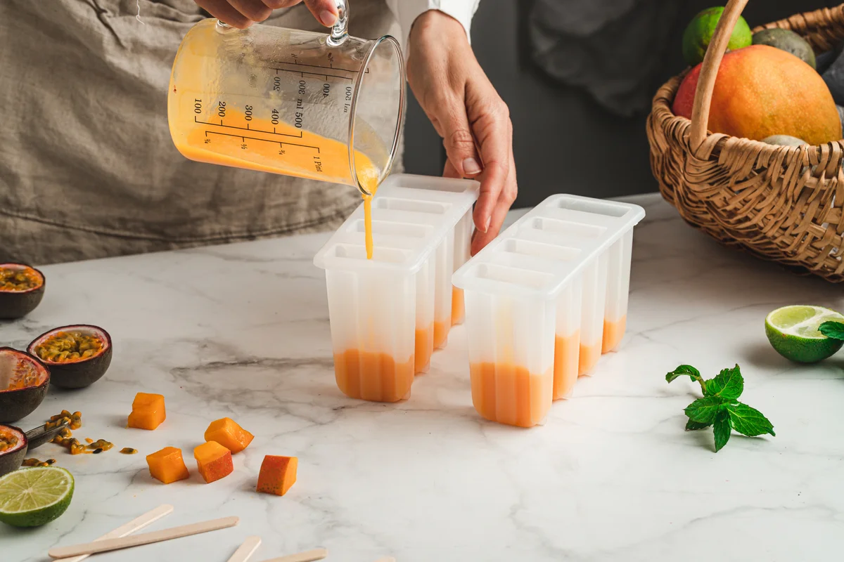 woman making passion fruit ice pops