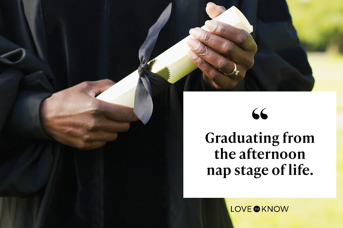 Woman in graduation gown holding diploma