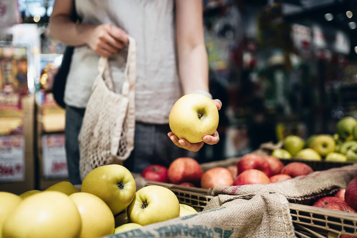 woman shopping for fruit
