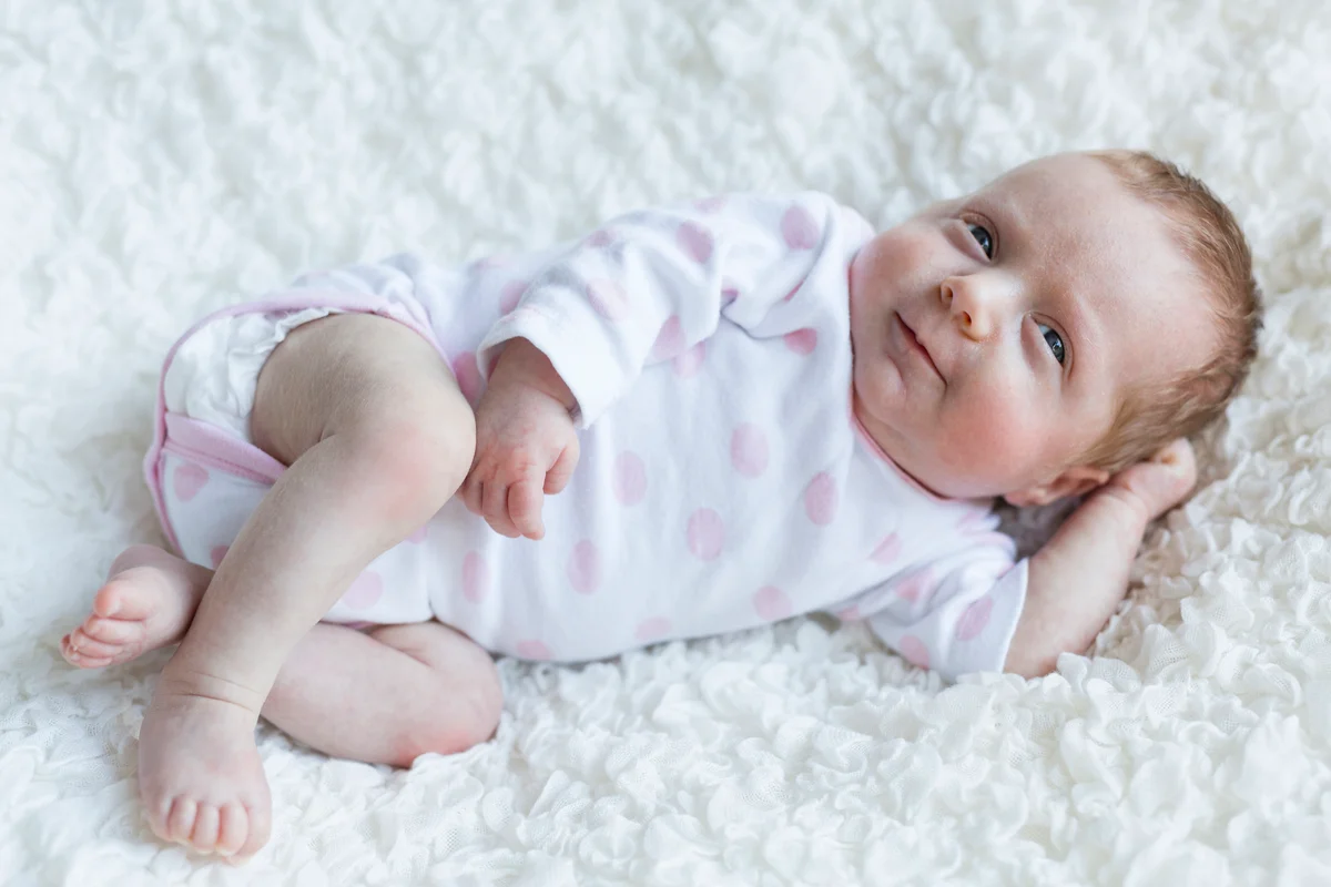 baby girl on a blanket