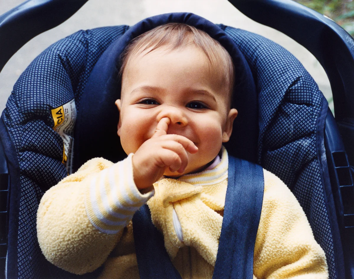 baby picking his nose