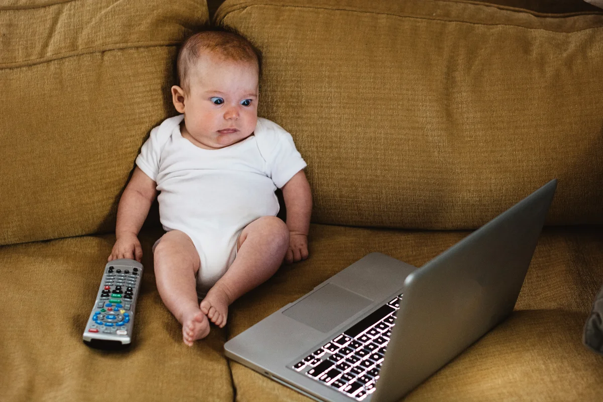 baby looking at a computer