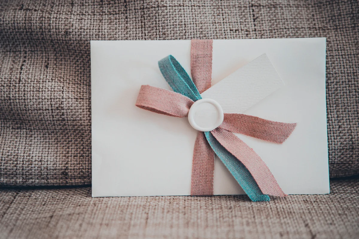 Close up of a wedding invitation on a wedding set
