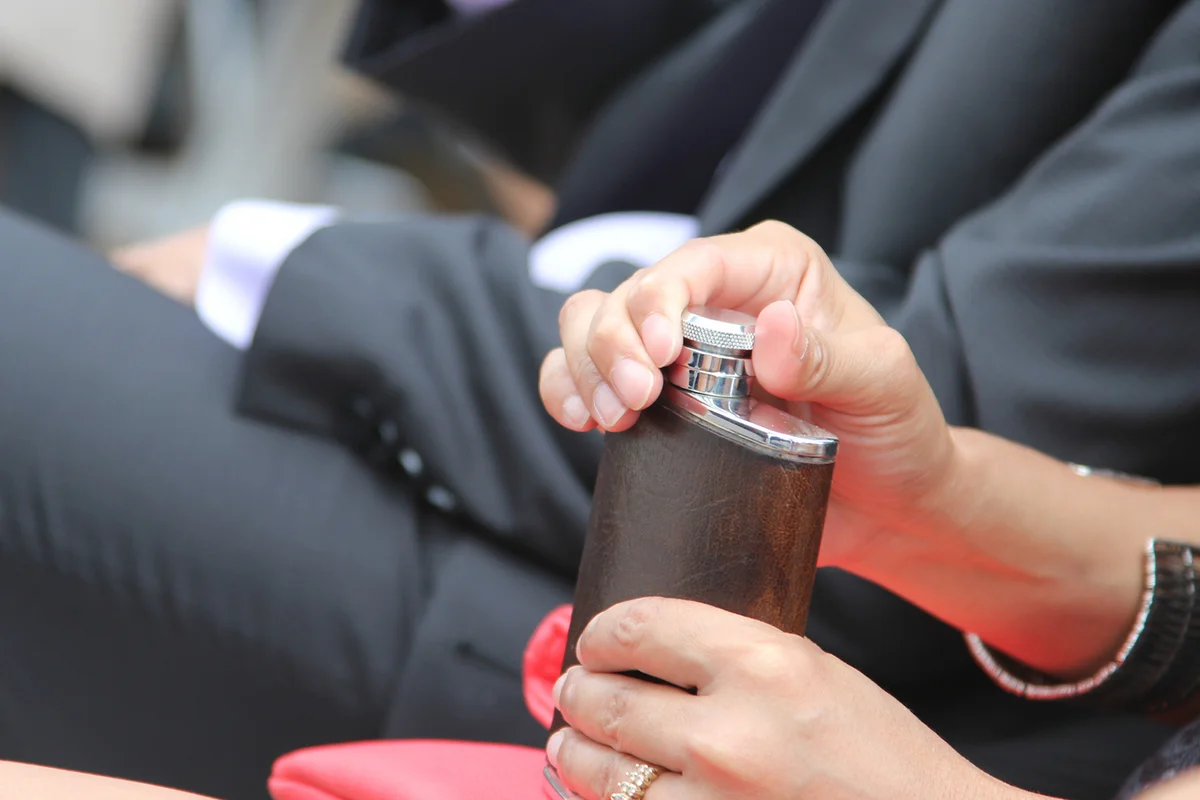 Woman with flask at formal event