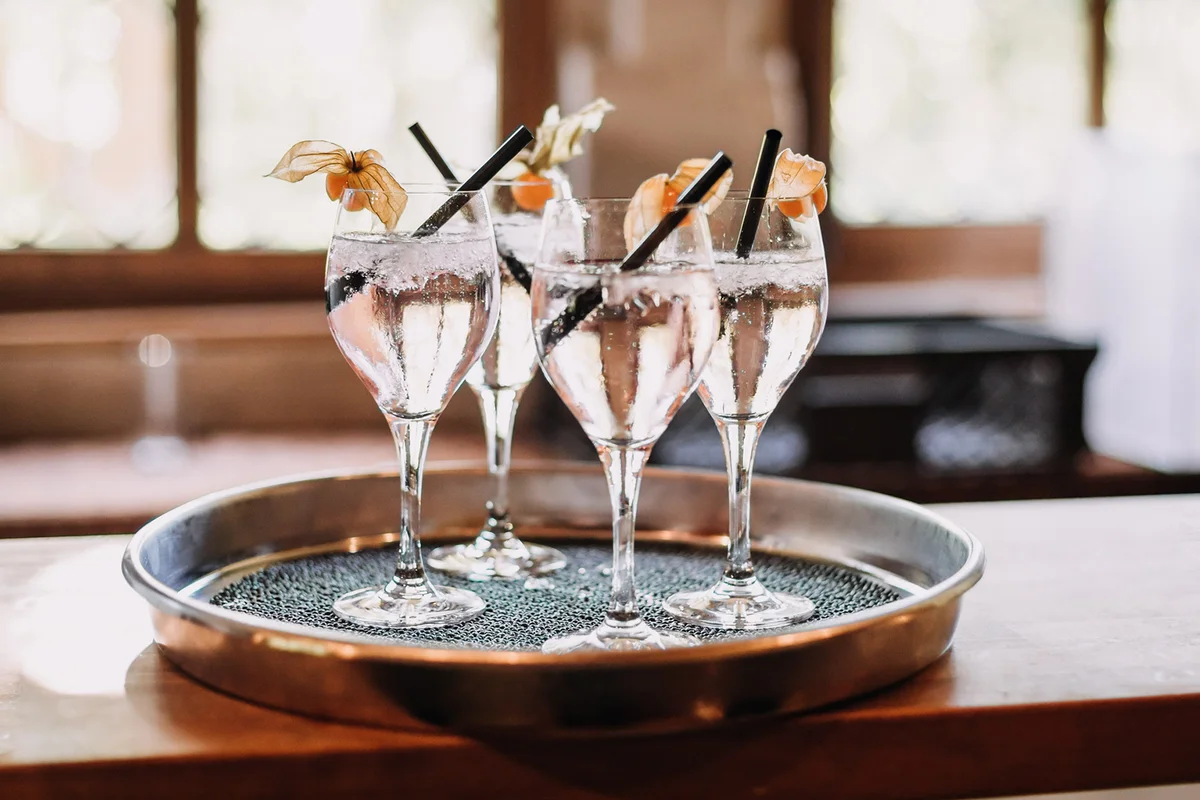 glasses with sparkling spritzer at summer wedding party