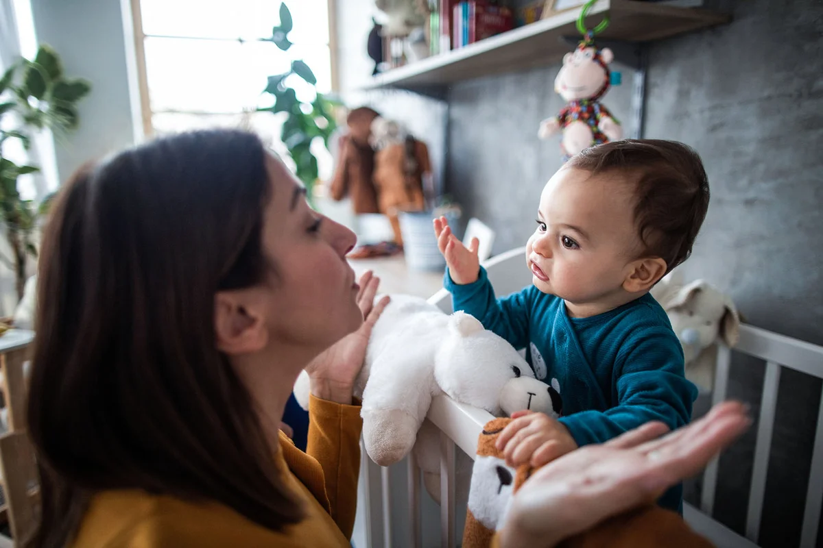 Mother and baby boy trying to understand each other