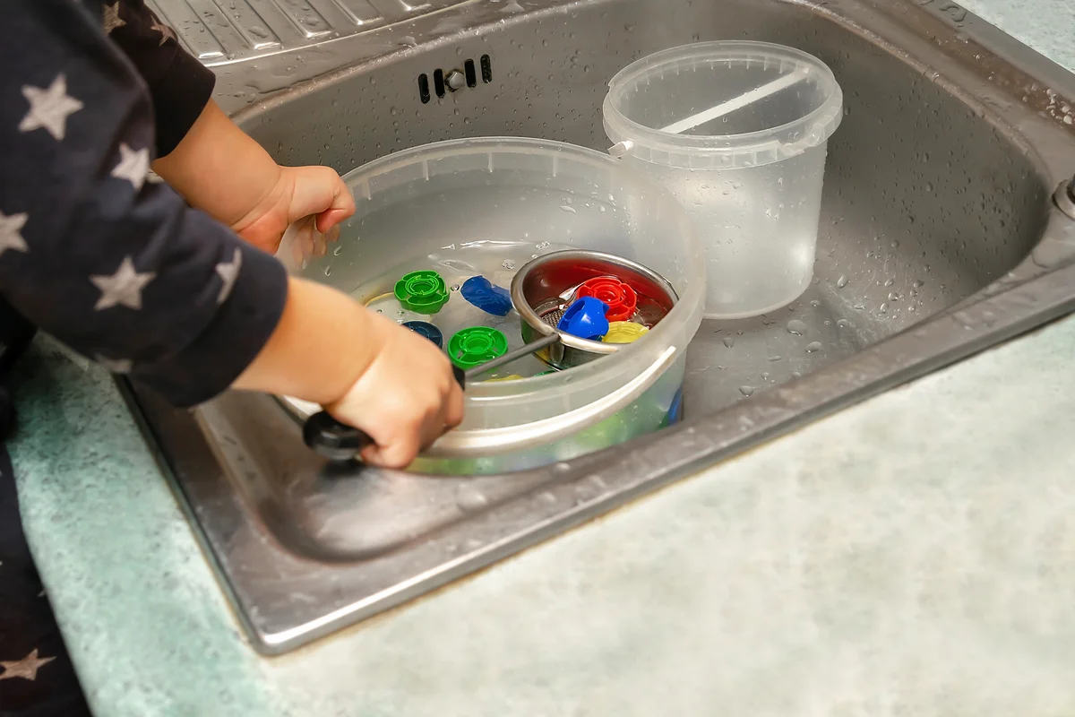 scooping water play activity