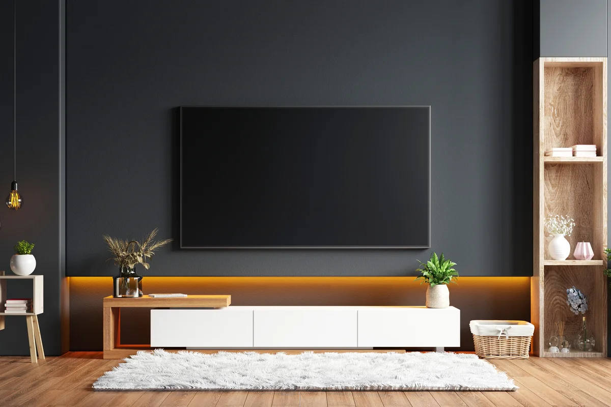 TV wall mounted in a black wall
