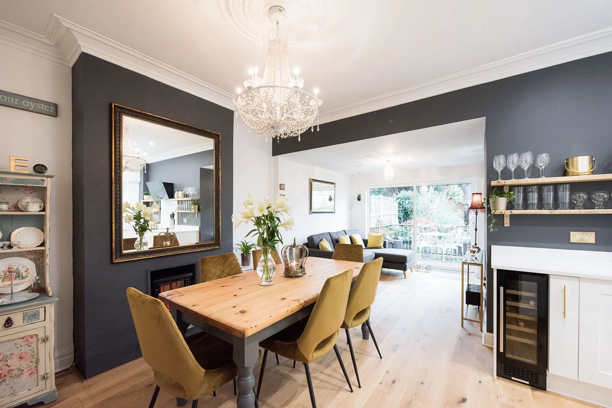 A open plan kitchen diner with white shaker style kitchen