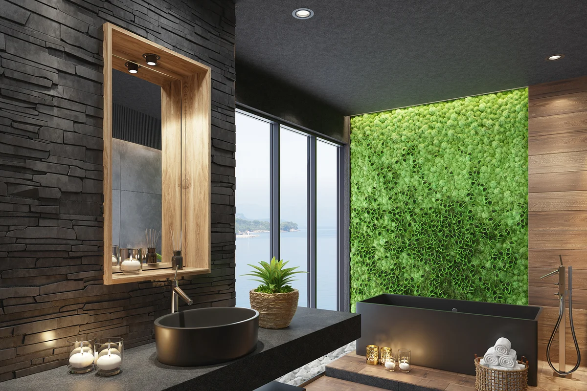 Luxurious modern home spa bathroom with matte black tiles and green moss plant wall
