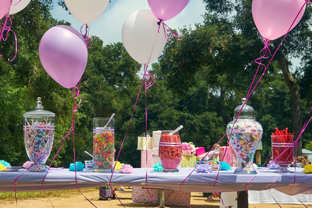 Balloons and candy laid out on a table