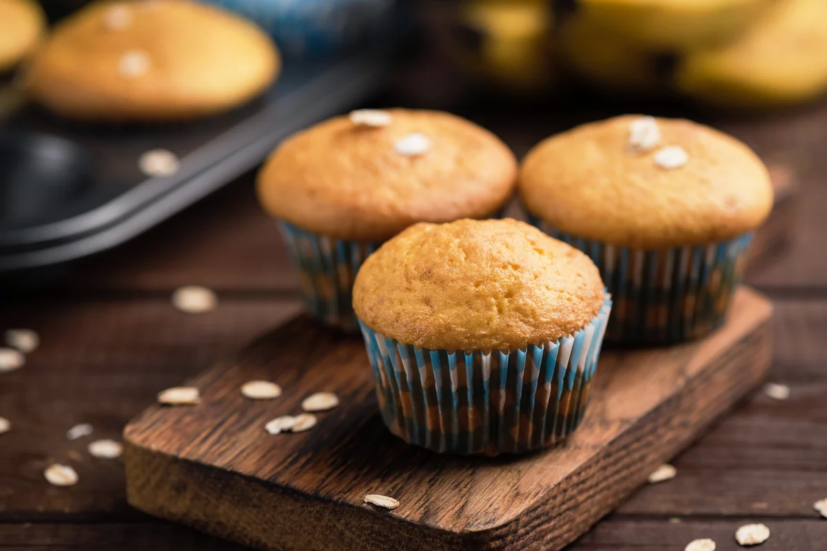 Oat banana muffins on wooden cutting board