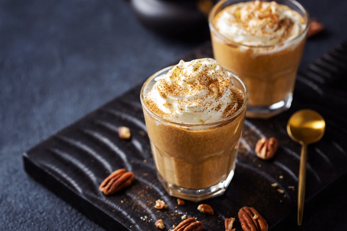 Pumpkin coffee drink with whipped cream and cinnamon