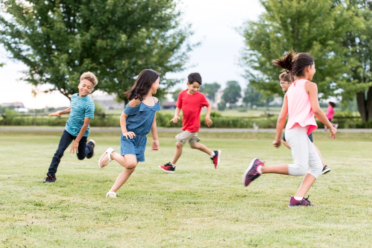 Elementary School Students Play at Recess stock photo