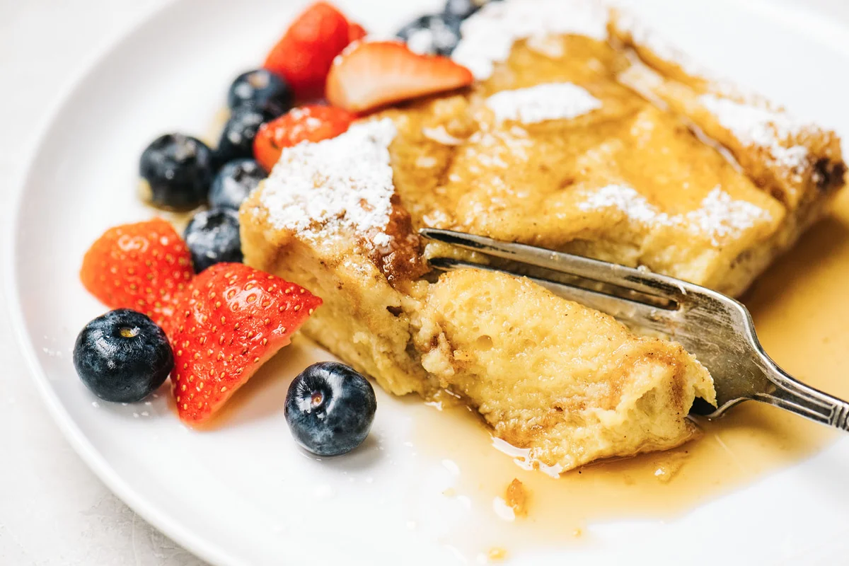 Fork cutting into French Toast Casserole