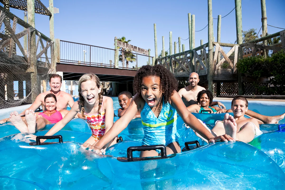 Smiling group at water park in innertubes