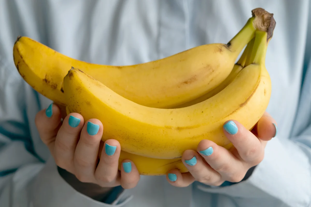 Woman holding bananas