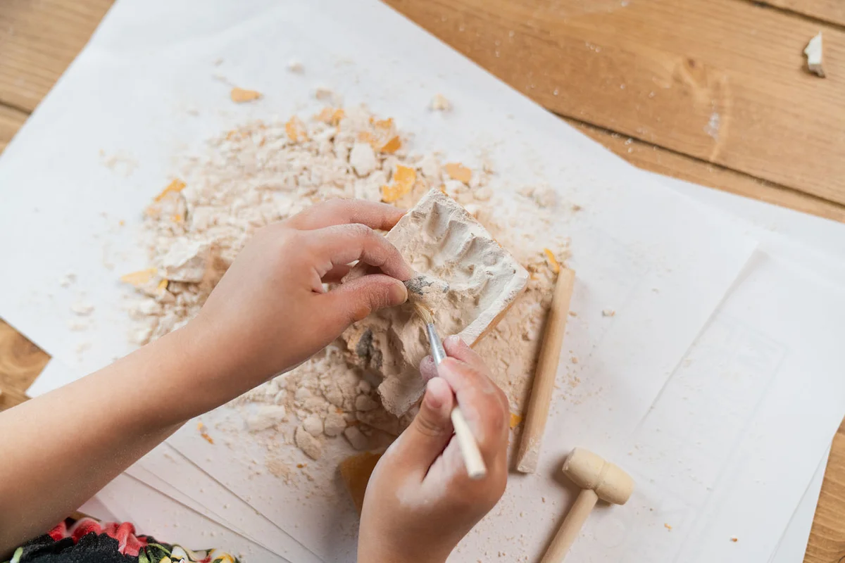 Young girl learning about archaeology at home