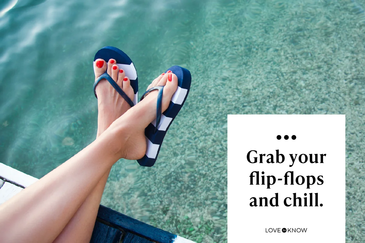 Woman feet with blue flip flops on the pier