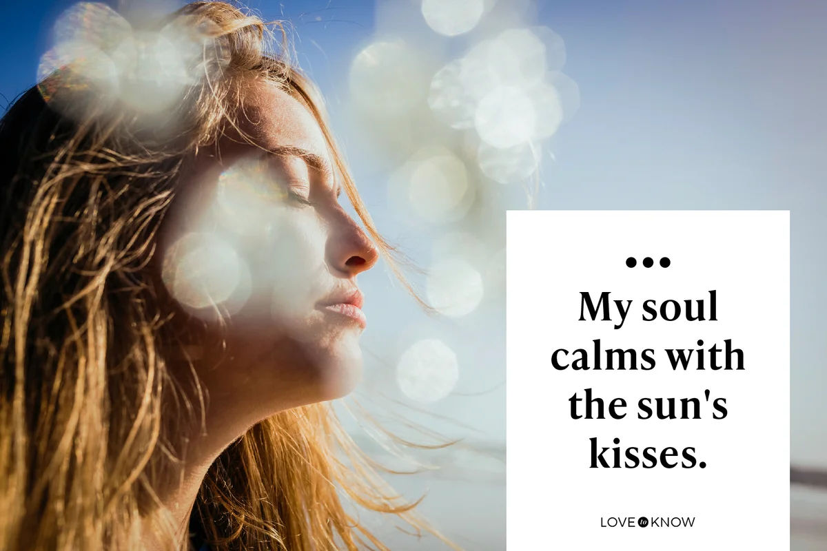 Serene woman basking in sunshine on beach