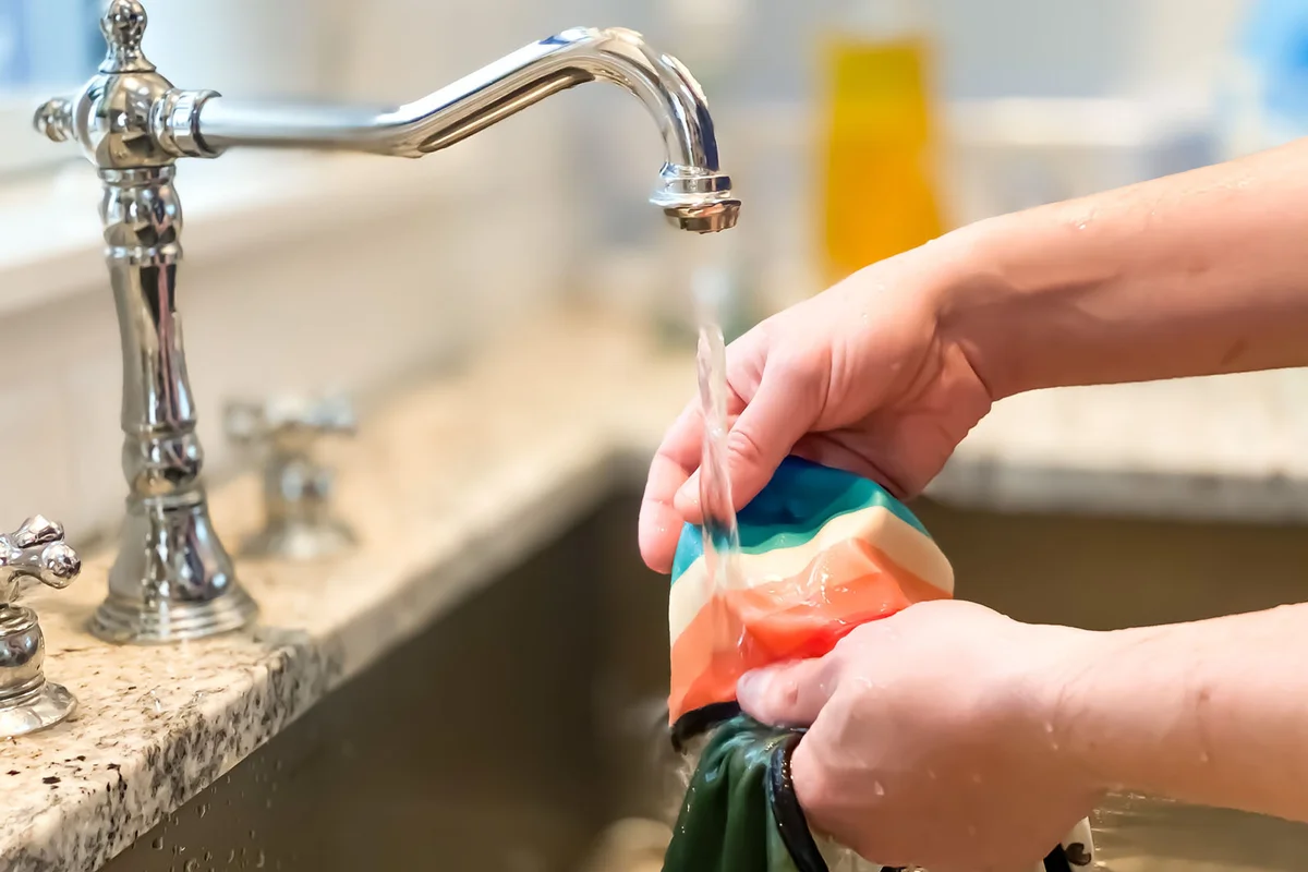 Men washing clothes on the sink