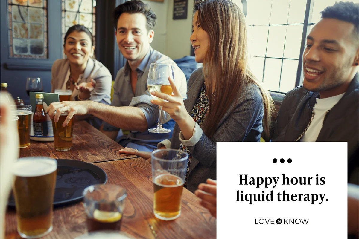 Friends drinking beer and wine and talking at a bar
