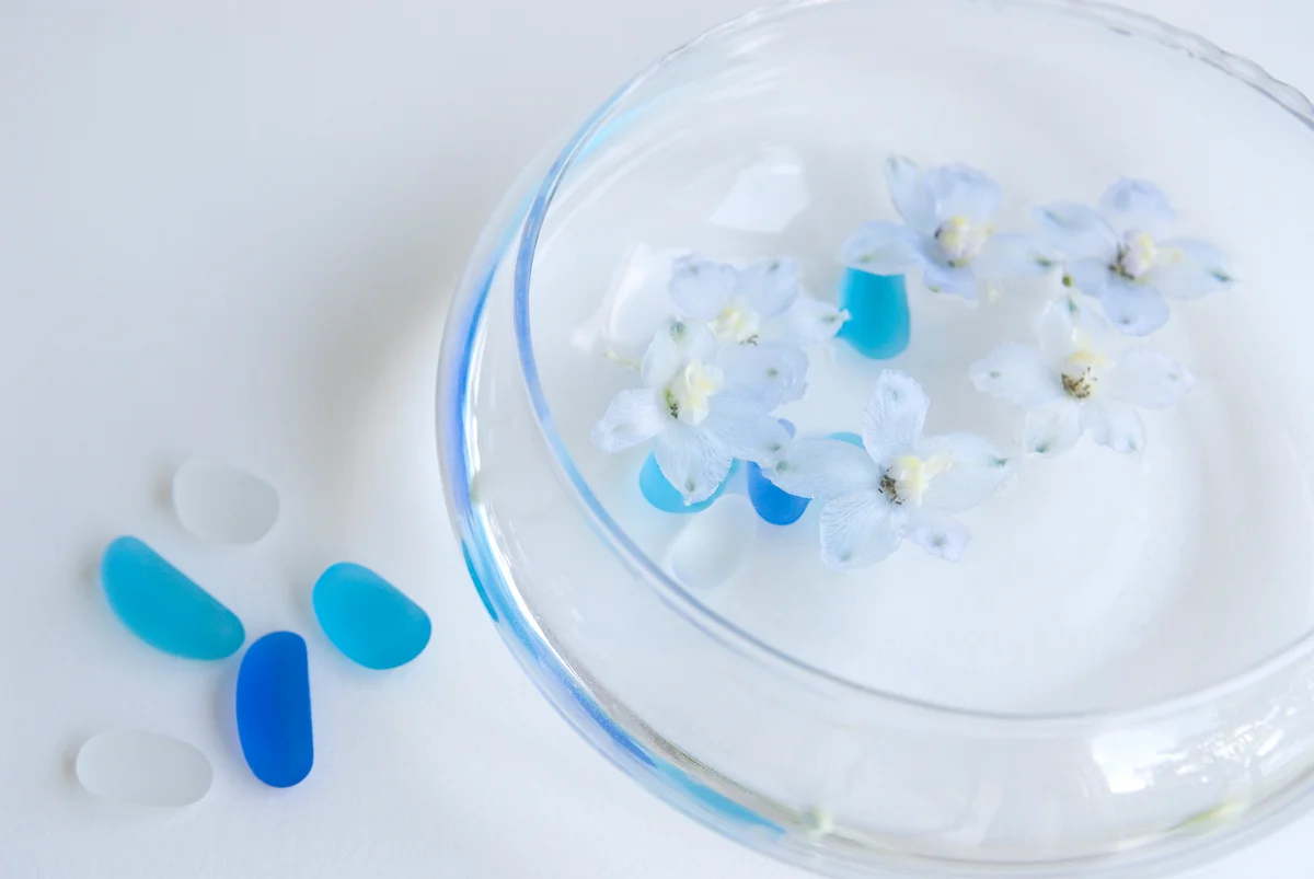 flowers floating in a glass bowl