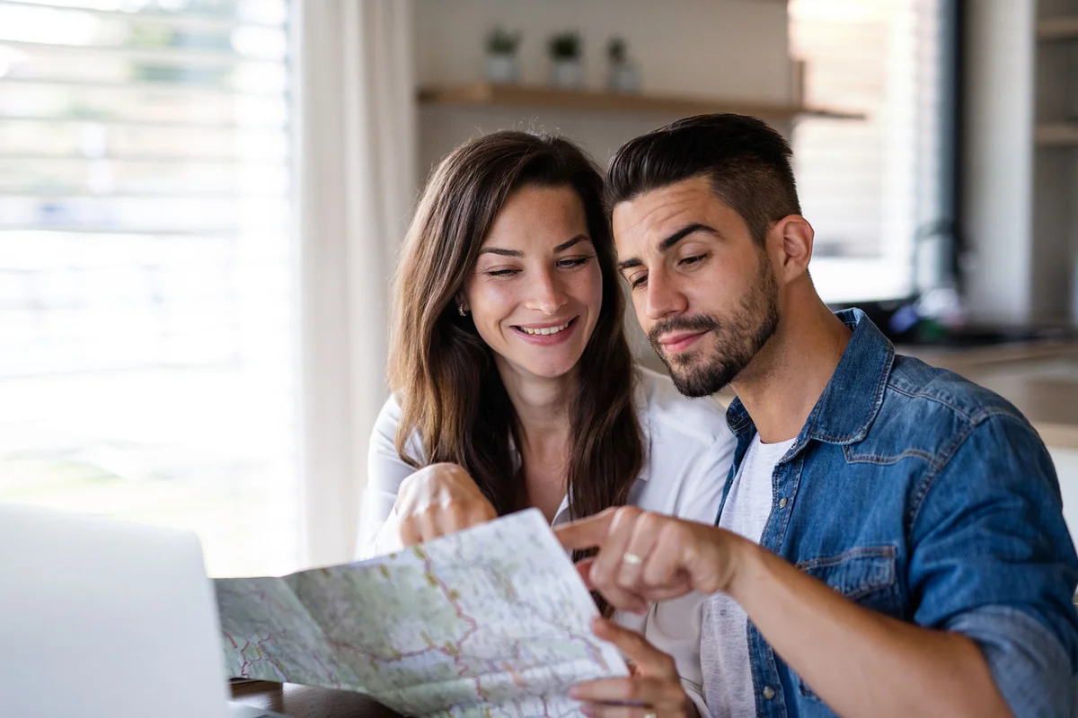 Young man and woman planning a trip