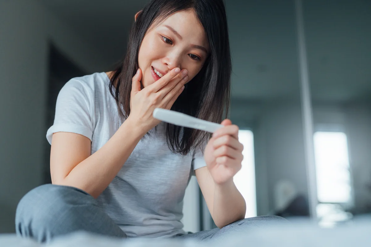 Woman with pregnancy test