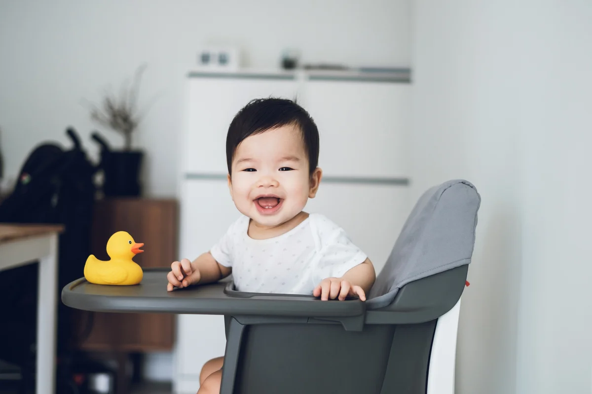 cute baby boy in high chair