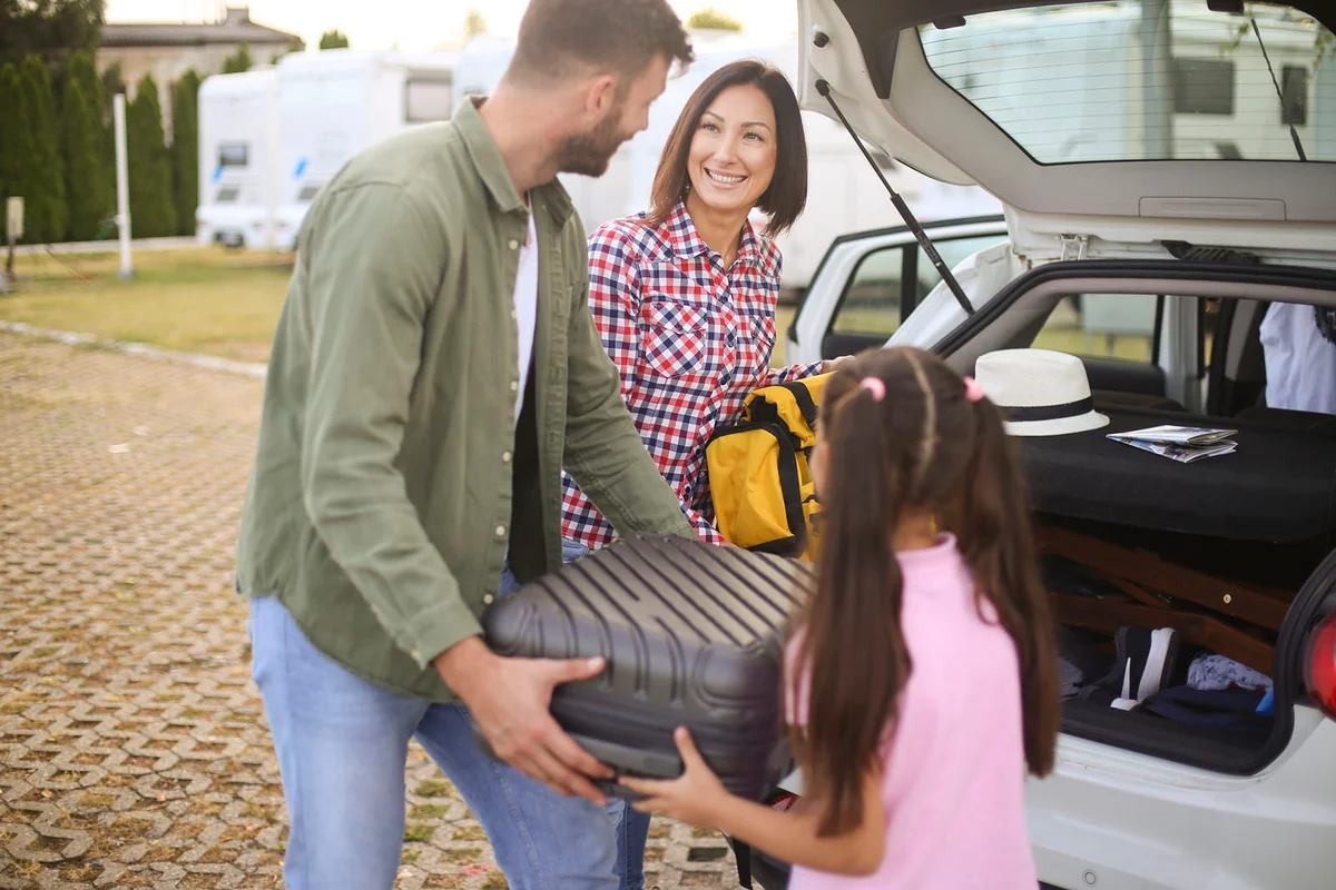 Family packing luggage