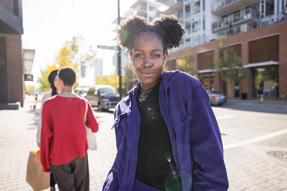 stylish young woman in sunny city