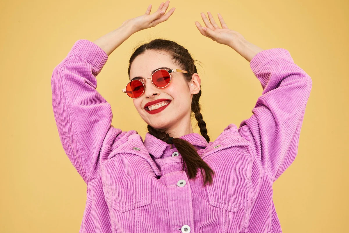 Colourful studio portrait of a young woman