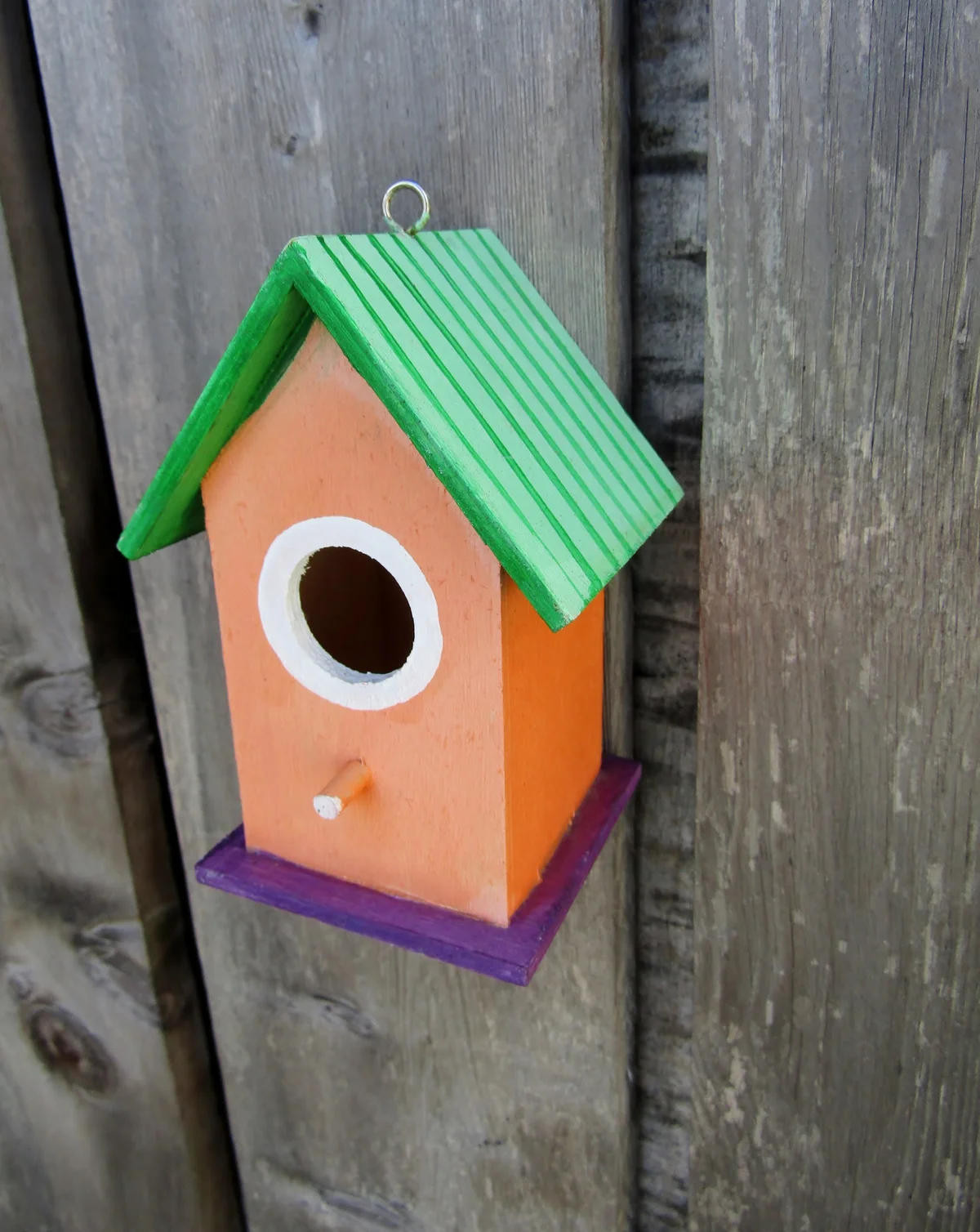Birdfeeder nailed to wood outside