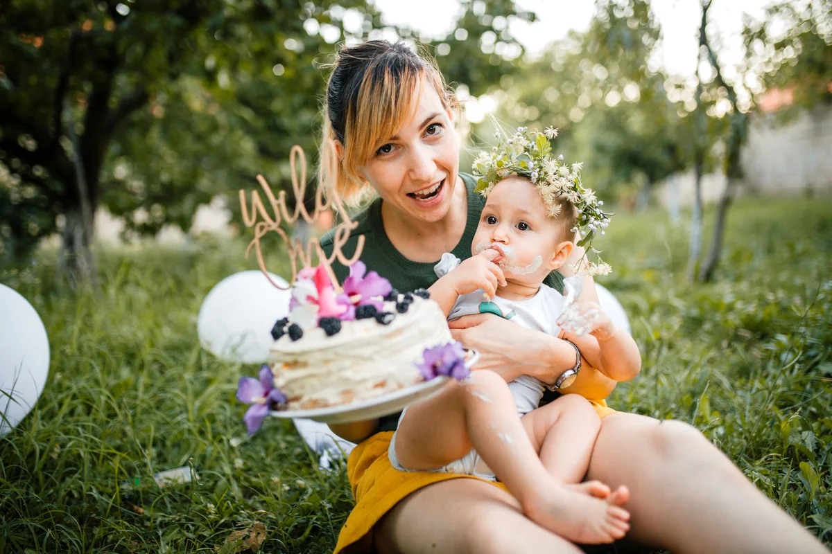 mom and babysit with wild one birthday cake