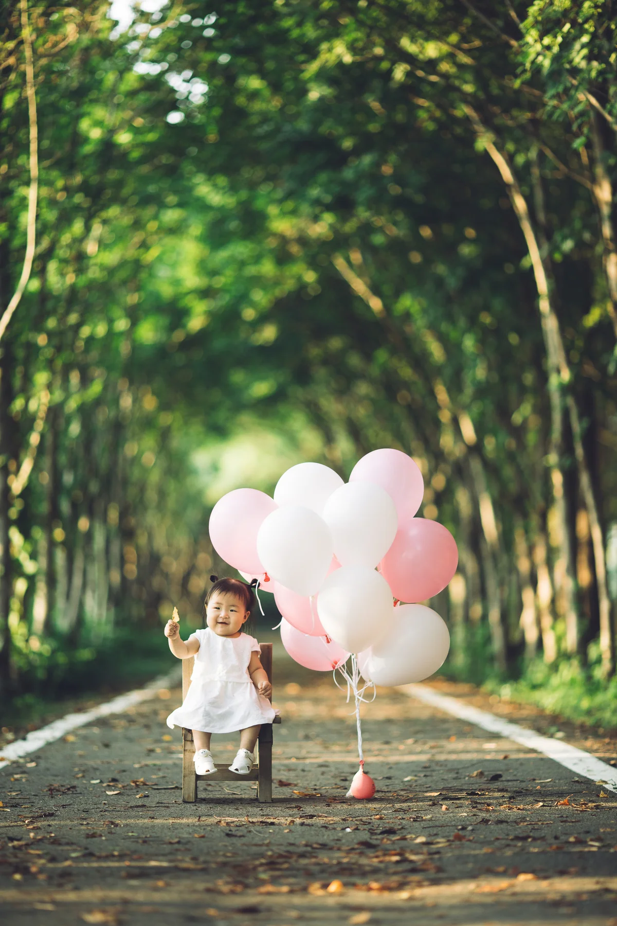 Baby with balloons
