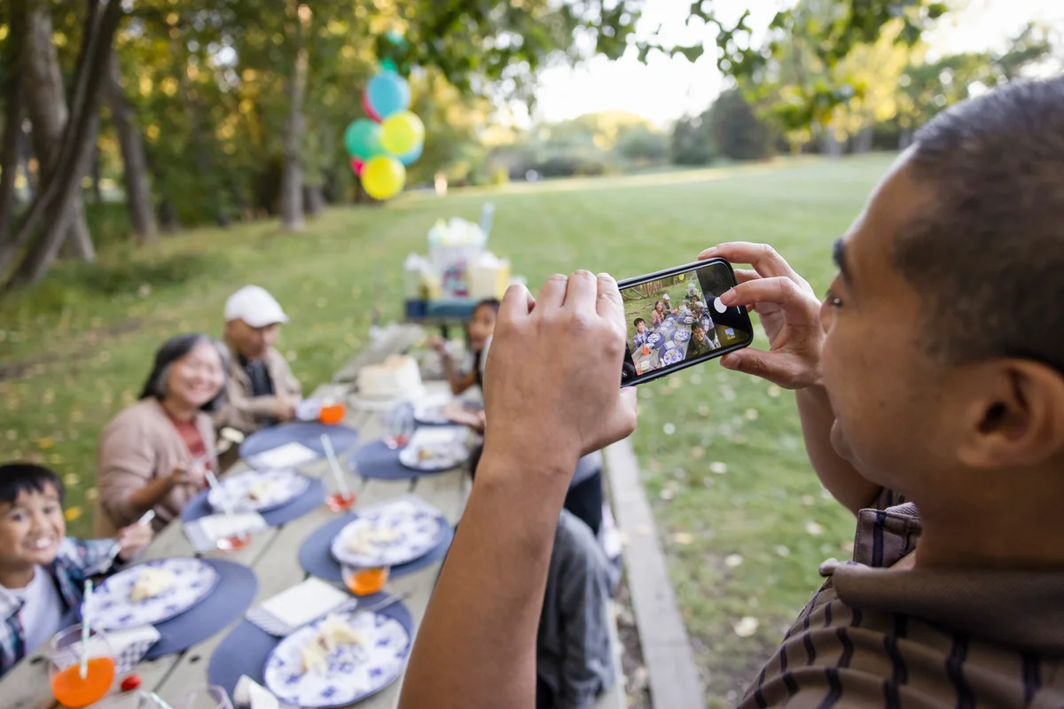 man taking a birthday photo