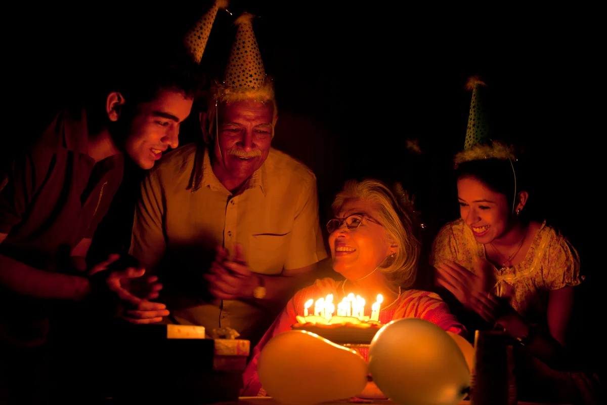 family photo with a birthday cake
