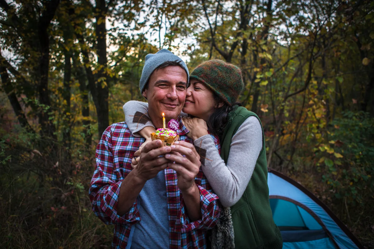 camping couple celebrating a birthday