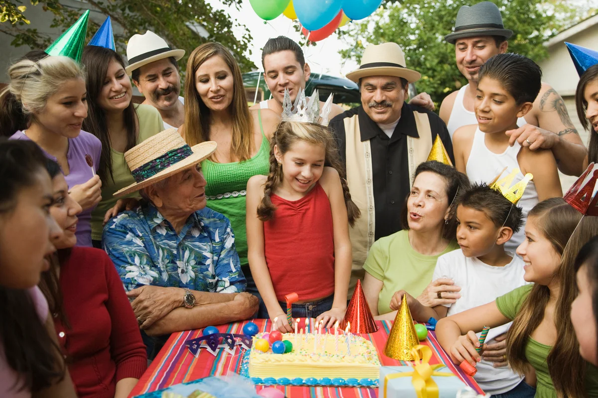 group gathered around a birthday cake