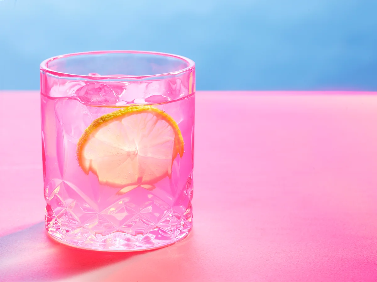 pretty pink drink with lemon garnish