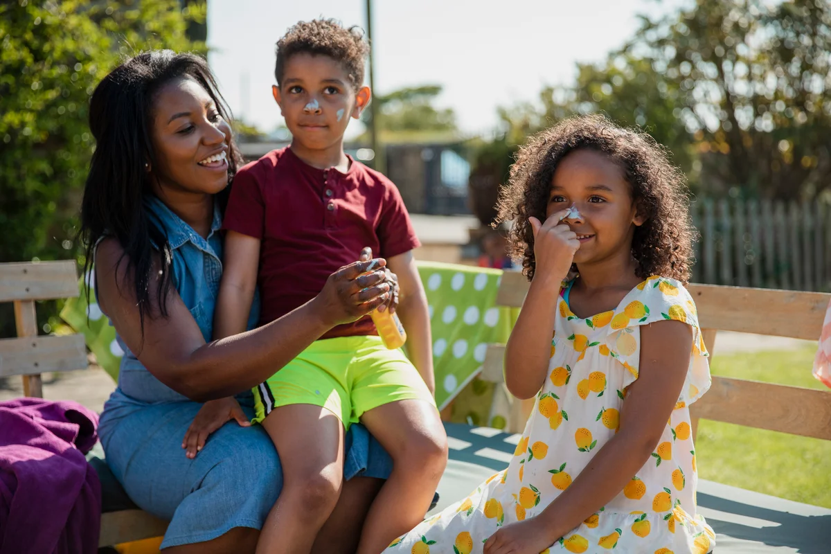 family applying sunscreen