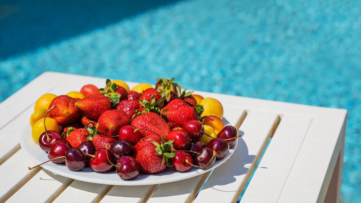 plate of fruit poolside