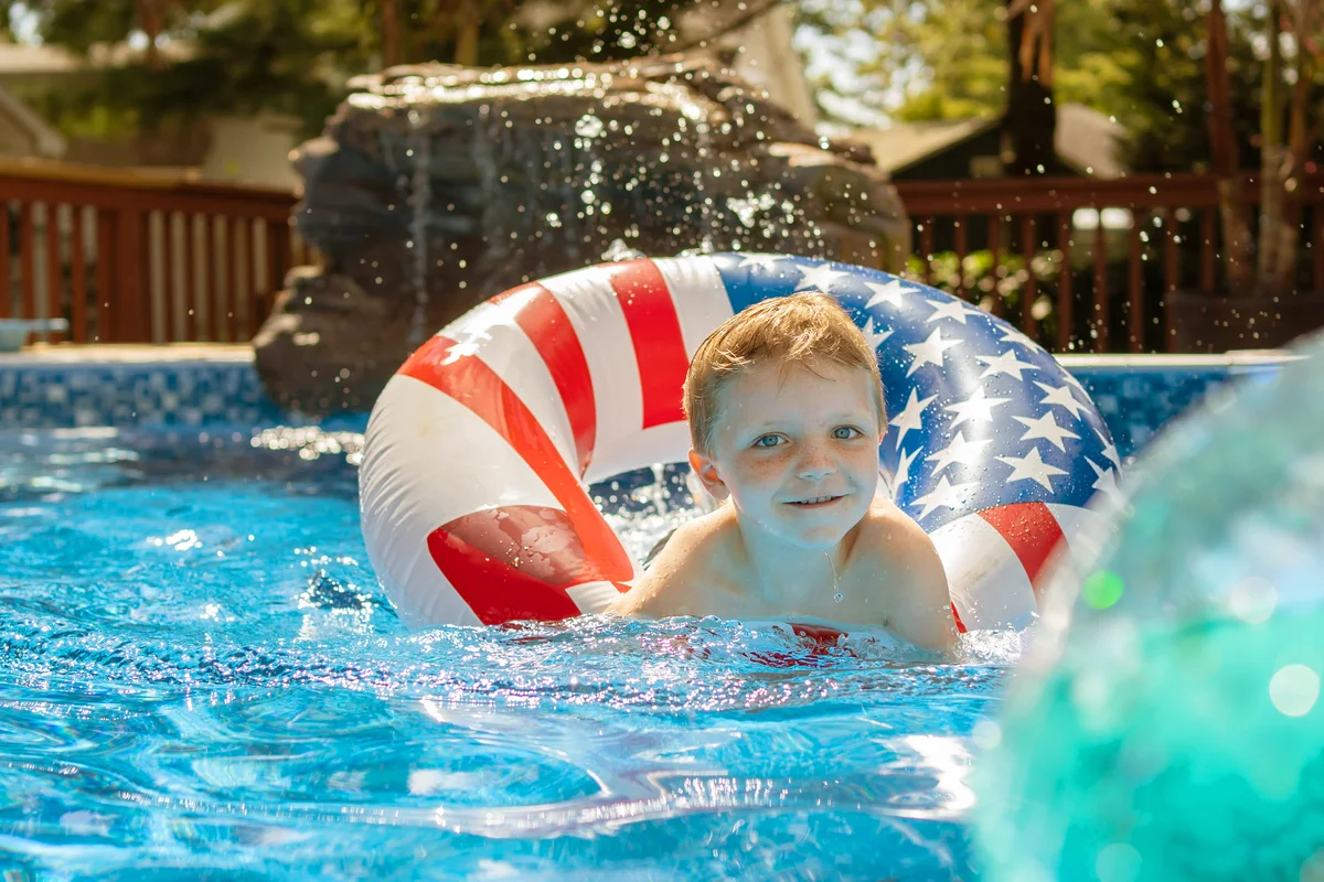 Kid playing in the pool