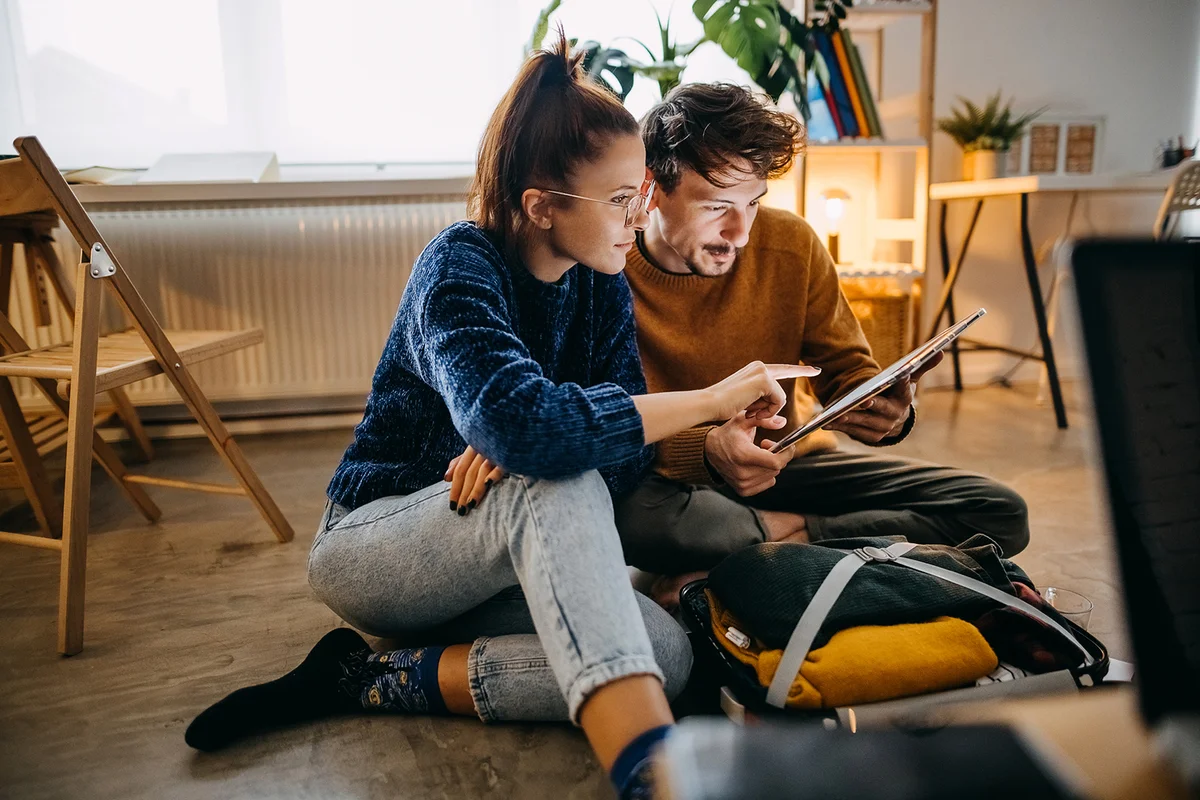 Couple searching information on tablet