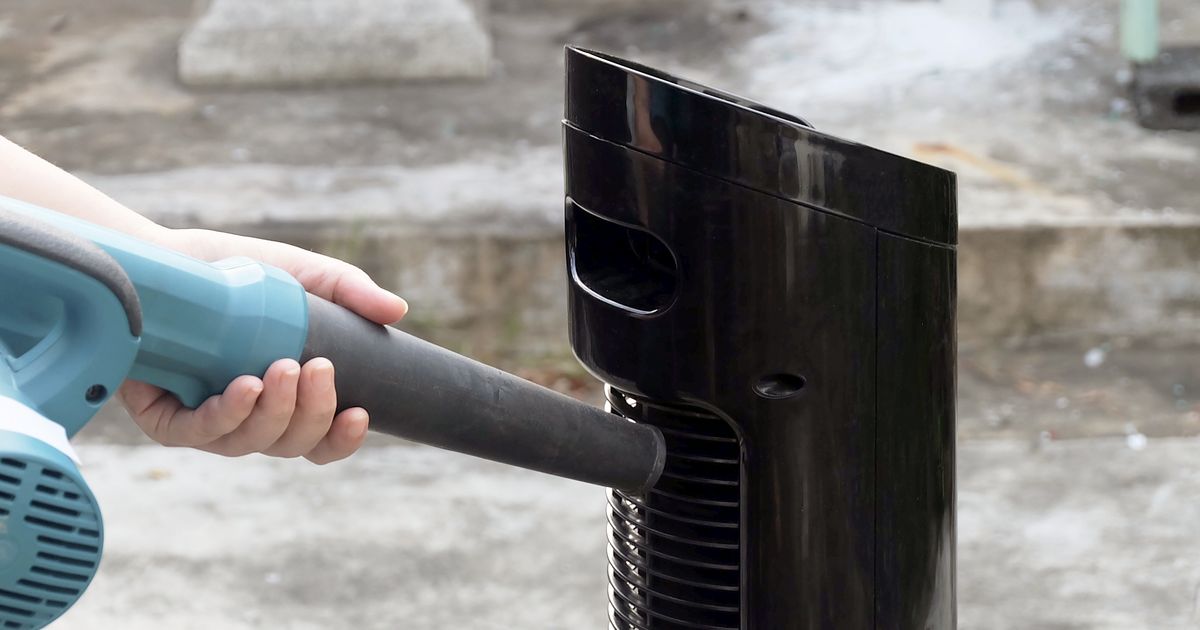 sealed tower fan vacuuming and compressed air cleaning process