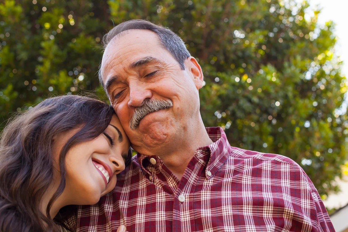 Father and daughter sharing tender moment