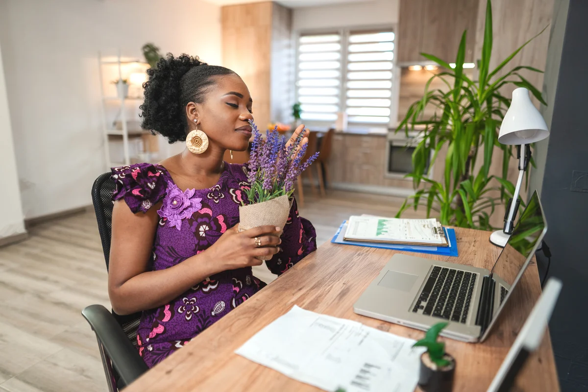 Woman smelling lavender in her home