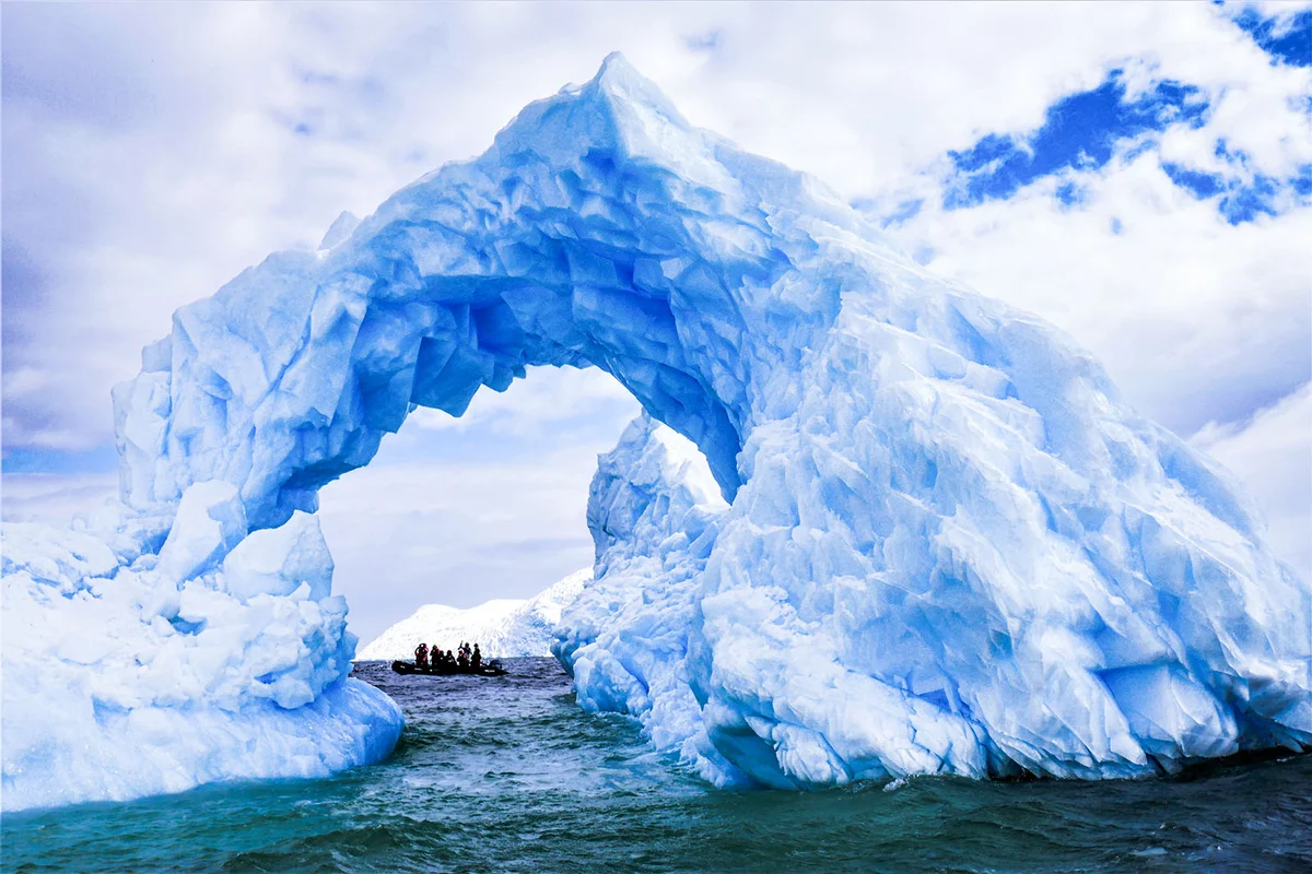 An iceberg of blue ice in Antarctica with an interesting hole