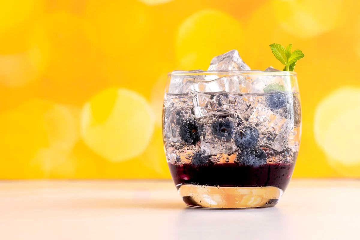 Modern refreshing drinks in glasses with ice cubes